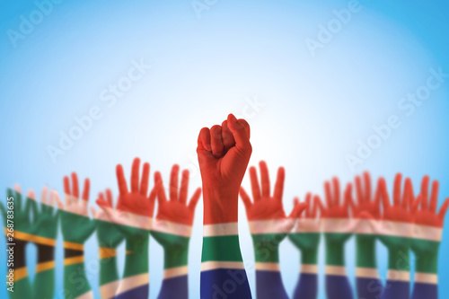 South Africa national flag pattern on leader\'s fist hands (clipping path)  for human rights, leadership, reconciliation concept