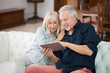 © Minerva Studio - Senior couple using tablet