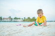 © haveseen - Three year old toddler playing on beach