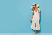 Relaxed Pretty Woman In White Summer Dress And Sun Hat
