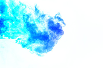 Colorful steam exhaled from the vape with a smooth transition of color molecules from turquoise to blue on a white background like a collision of two jets of smoke. Malicious virus and drug injection.