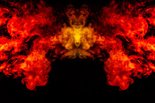 Smoke Of Different Orange And Red Colors In The Form Of Horror In The Shape Of The Head, Face And Eye With Wings On A Black Isolated Background. Soul And Ghost In Mystical Symbol
