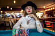 © RomanR - Young lady in casino with four aces