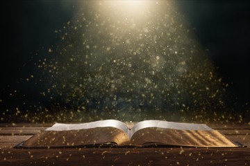 Wall Mural - open book on old wooden table.