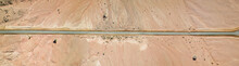 Old Desert Road With Cracked Asphalt, Top Down Aerial Image.