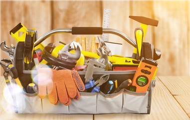 Wall Mural - Gloves and tools on wooden background
