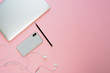 Laptop Phone Earphone Pink Minimal Top Flat Lay Copy Space. Smartphone and Pencil on Freelance Contemporary Workspace Background. Blank Corporate Workplace Inspiration Simple Mock Up Concept Layout