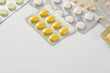 © worldofstock - Group of multi colored pills, capsule with copy space on white background