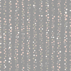  Seamless vertical striped pattern of pebbles and hollow circles on a grey background.