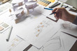 © Chaosamran_Studio - architect design working drawing sketch plans blueprints and making architectural construction model in architect studio