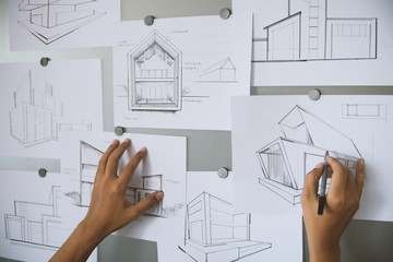 Architect Designer Engineer sketching drawing draft working Perspective Sketch  design house construction Project