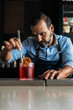 © Santi Nunez/Stocksy - Professional young bartender working