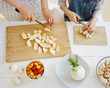 © Duet Postscriptum/Stocksy - Crop shot. Mother and daughter cutting vegetables