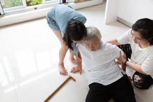Asian Elderly Woman With Walking Stick On Floor After Falling Down And Caring Woman Assistant,sick Senior Or Mother Dizziness,faint,having A Daughter,granddaughter To Help And Take Care Of Her