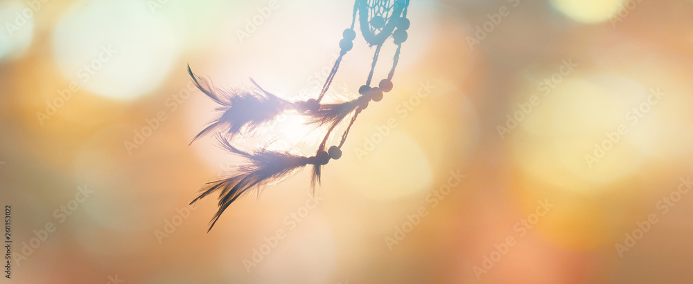 Blurred image, Dream catcher native american in the wind and blurred bright light backgrounds, abstract hope and dream concepts - obrazy, fototapety, plakaty 