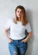 Young beautiful woman in white t-shirt and jeans