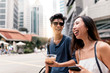 © Santi Nunez/Stocksy - Smiling couple chatting and having fun in the street.