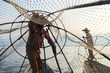 © Ivan Gener/Stocksy - Unrecognizable traditional Shan fishermen at Inle lake, Myanmar.