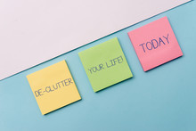Text Sign Showing De Clutter Your Life. Business Photo Showcasing Remove Unnecessary Items From Untidy Or Overcrowded Places Pastel Colour Note Papers Placed Sideways On The Of Softhued Backdrop
