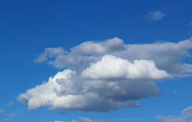 Blue sky with soft clouds for abstract background and postcard