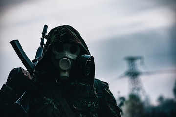 A man with a weapon in the city of Chernobyl