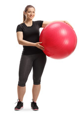 Sticker - Young smiling woman posing with a fitness ball