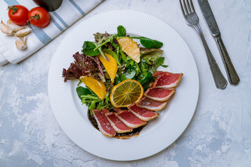 Wall Mural - salad with duck on a white plate