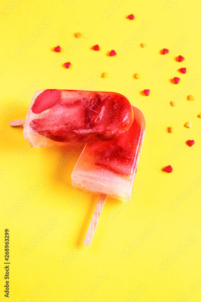 Tasty strawberry ice cream on color background