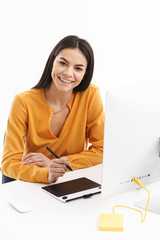 Sticker - Portrait of caucasian young designer woman using graphic tablet computer and stylus pen in bright office