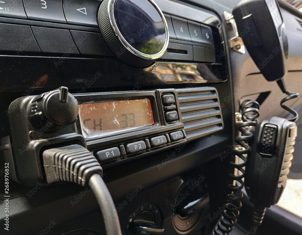 Police patrol car radio equipment and microphone. Walkie-talkie. Selective  focus., obrazy, fototapety, plakaty - BajeczneObrazy.pl