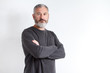 © Sahaidachnyi Roman - Half-length portrait of a serious gray-haired bearded man in a gray t-shirt on a white background