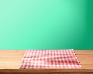 Poster - Red cloth napkin on wooden background