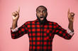 © Drobot Dean - Portrait of a shocked african man wearing plaid shirt