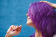 © Ekaterina - girl with purple hair on blue background