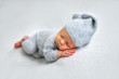 © Oksana - Sleeping newborn boy in the first days of life on white background