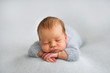 © Oksana - Sleeping newborn boy in the first days of life on white background
