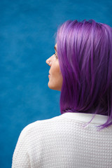 girl with purple hair on blue background