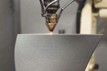 3D metal printer produces a steel part.