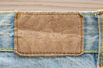 Blue denim jeans leather label texture background