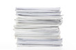 © suriya - Close-up of papers stack isolated on a white background