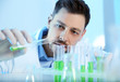 © New Africa - Male scientist working with sample in chemistry laboratory