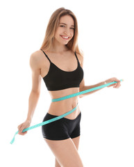 Poster - Slim woman measuring her waist on white background. Perfect body