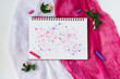 Blank page of open notebook and decor items on pink and white background. Notepad with empty page top view. Sketchbook spread mockup. Artistic mockup.Pastel and flowers.
