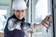 © auremar - female worker measure the window
