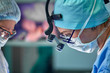 © Georgii - Close up portrait of female surgeon doctor wearing protective mask and hat during the operation. Healthcare, medical education, surgery concept.