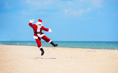 Christmas Santa Claus on the beach. New Year's travel vacation discounts and travel agencies price reductions concept.