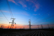 © hanmaomin - A silhouette of a high voltage tower at sunset