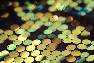 Wall Mural - Sequins. golden  sequins macro blurred background.Texture scales with Sequins close-up.Shiny texture sequin material