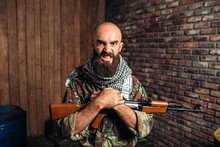 Terrorist In Uniform Holds Kalashnikov Rifle