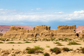 Wall Mural - Ruins of Gaochang, Turpan, China. Dating more than 2000 years, Gaochang and Jiaohe are the oldest and largest ruins in Xinjiang. The Flaming mountains are visible in the background